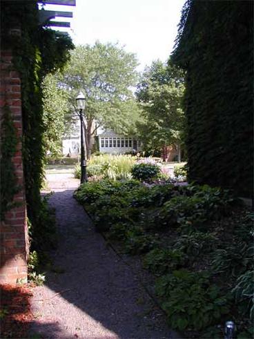 garden path with plants and lamp post