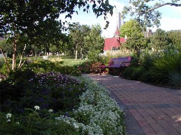 brick path with garden plants